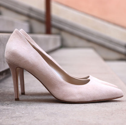 Close-up of Paoul Camilla ladies powder suede bridal and ballroom dance shoes with stiletto heel, displayed on outdoor stone steps.