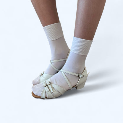 International Dance Shoes short ballet socks for kids in white, paired with open-toe dance shoes. Soft, comfortable fit for young dancers.