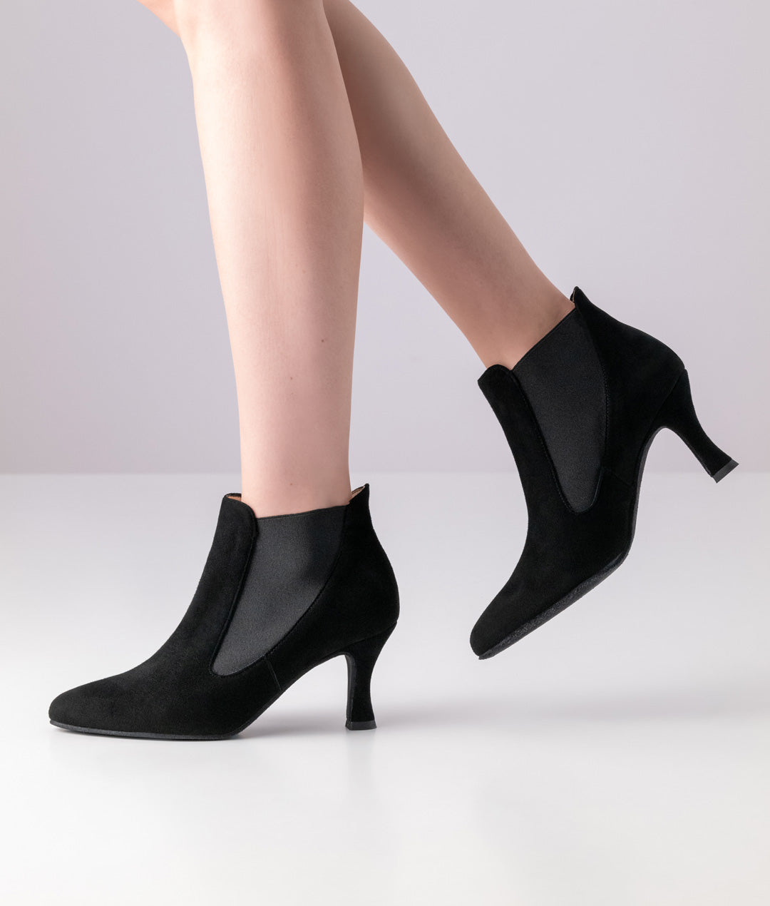 Left side view of dancer wearing Werner Kern Carina Black Suede Social Dance Ankle Boot with Elasticated Side Inserts