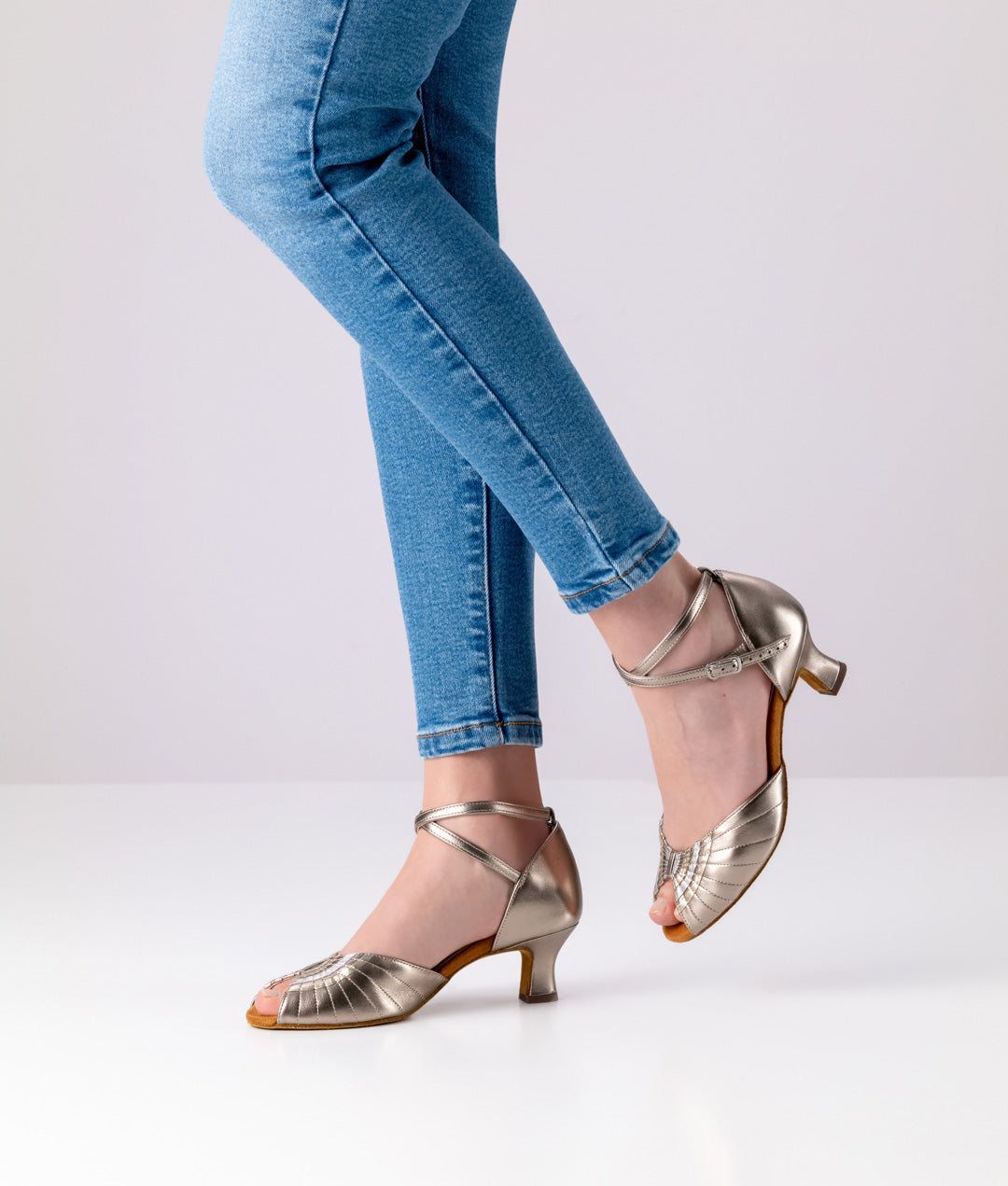 Dander wearing Werner Kern Corinne Ladies Antique Bronze Social Dance Shoe with Silver and Gold Accents